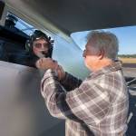 John Norman congratulates pilot Ron Fowlers hand after he successfully flew Normans replica of the Spirit of St. Louis on July 28 in Arlington. (Andy Bronson / The Herald)