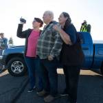 John Norman, his wife, Heather (right), and daughter Amber Nelson watch as his replica of the Spirit of St. Louis takes off on its first flight from Arlington Municipal Airport on July 28. (Andy Bronson / The Herald)