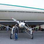 Pilot Ron Fowler helps pull John Normans replica of the Spirit of St. Louis out from its hangar at Arlington Municipal Airport on July 28. (Andy Bronson / The Herald)