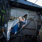 Getting into the cockpit is no easy feat as pilot Ron Fowler stretches a leg into John Normans replica of the Spirit of St. Louis before taking the plane out on its first flight July 28. (Andy Bronson / The Herald)