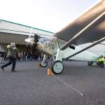John Norman cranks the propeller of his Spirit of St. Louis replica July 28. (Andy Bronson / The Herald)