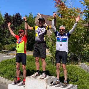 Contributed photo. Medalists receive their awards in Olympia, from right to left: Jerry Nelson, bronze winner, Steve N. Sills, gold winner and Bob Stavers, silver winner.