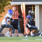 Kaden Ritchie, number 32, runs along the sideline for good yardage. <em>(John Stimpson/contributed photo)</em>