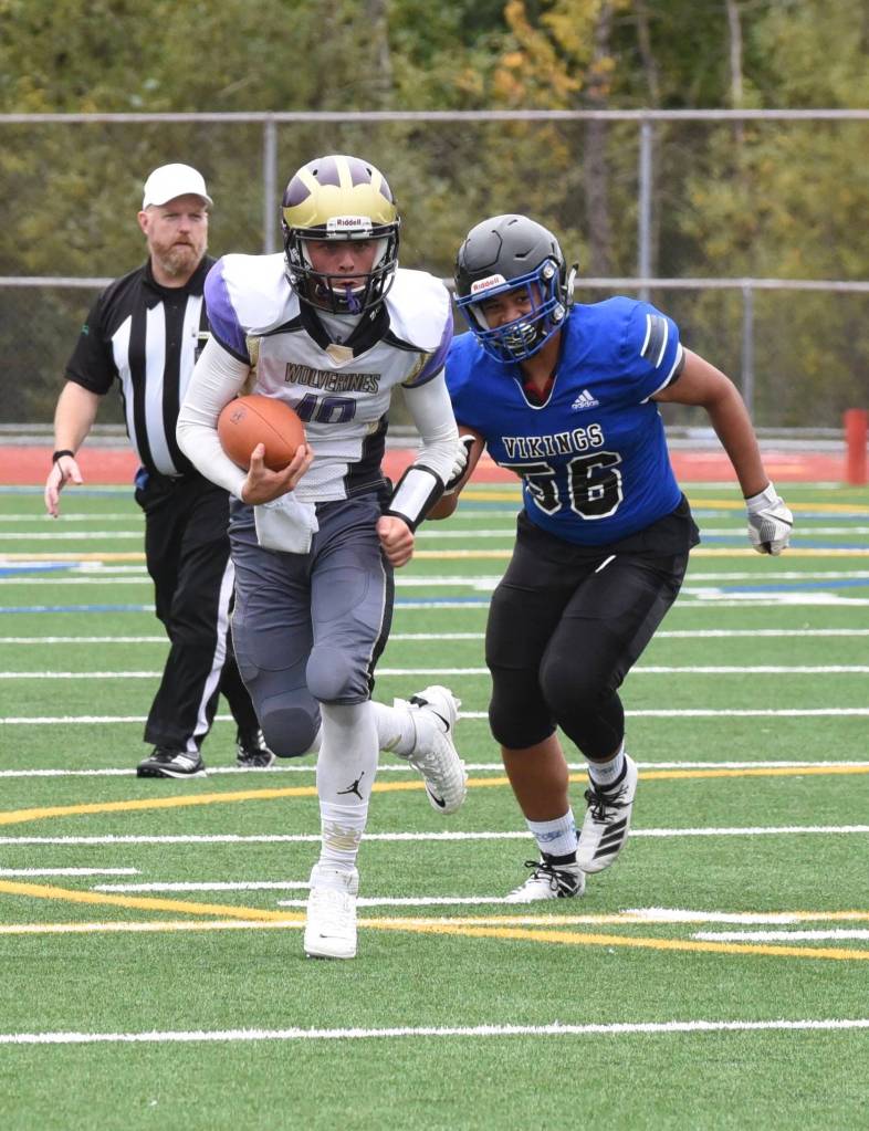 Wolverine quarterback Jaden Jones (10) scrambles for a good yardage gain. <em>(John Simpson/Contributed photo)</em>