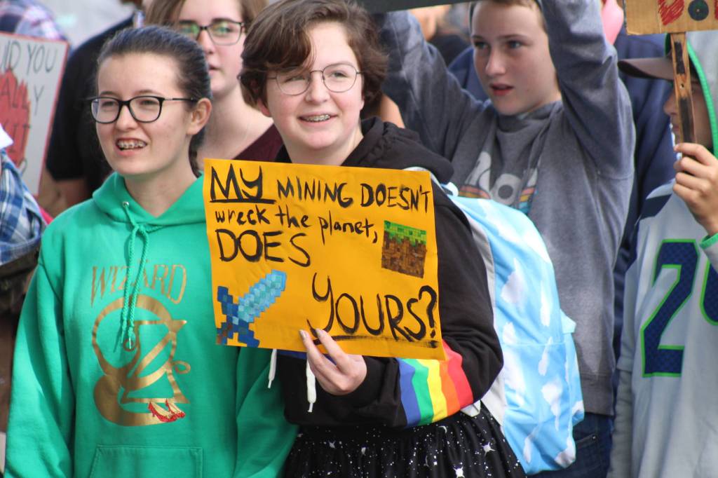 Students chant at Memorial Park during the Global Climate Strike. <em>(Heather Spaulding/staff photo)</em>
