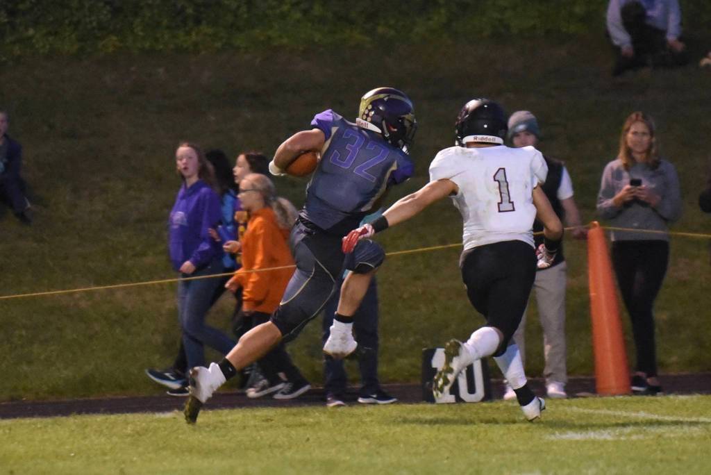 Kaden Richie, No. 32, races down the sideline for a huge yardage gain. <em>(John Stimpson/Contributed photo)</em>