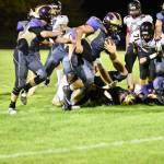 Ty Vague, No. 65 strip,s the ball from the Wolves ball carrier and runs for a touchdown. <em>(John Stimpson/Contributed photo)</em>