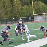 Wolverines Brian Wolf, 26, and Jaden Jones, 10, close in on the Turks running back and knock him out of bounds. <em>(John Stimpson/contributed photo)</em>