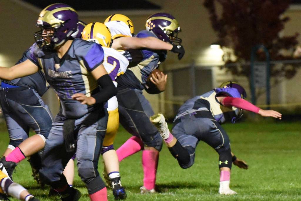 Mateo Blackmon, No. 42, pushes forward over the goal line dragging two Lions with him and scoring a touchdown. (John Stimpson/Contributed photo)
