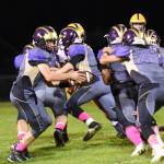 Quarterback Dylan Roberson, No. 7, hands off to Connor Haines, No. 29, for a run up the middle. (John Stimpson/Contributed photo)
