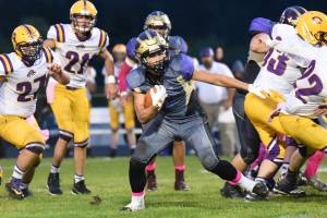 Kaden Ritchie, No. 32, breaks through for a good yardage gain. (John Stimpson/Contributed photo)