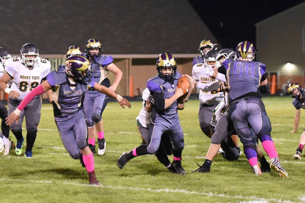 #30 Geoffry Volk runs up the middle for a good yardage gain. John Stimpson/Contributed photo.