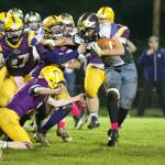 Kaden Ritchie, No. 32, fights his way through the Lions for a good yardage gain. (John Stimpson/Contributed photo)