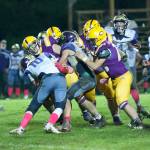 Jaden Jones, No. 10 and Austin Wynne, No. 55, stop the Lions running back for no gain of yards. (John Stimpson/Contributed photo)