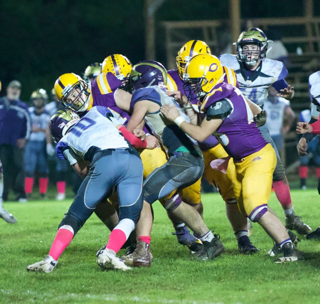 Jaden Jones, No. 10 and Austin Wynne, No. 55, stop the Lions running back for no gain of yards. (John Stimpson/Contributed photo)