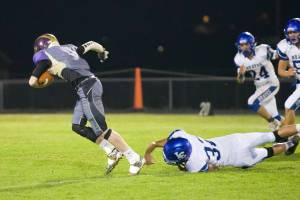 Jordan Lawson, No. 14, receives a pass, shakes off a tackle and heads for the end zone. (John Stimpson/Contributed photo.)