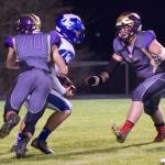 Will Leeming, No. 70, and Weston Swirtz, No. 68, put the stop on the Braves ball carrier. (John Stimpson/Contributed photo.)