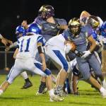 Gabriel Garcia, No. 16, fights his way for a good yardage gain to the goal line. (John Stimpson/Contributed photo.)