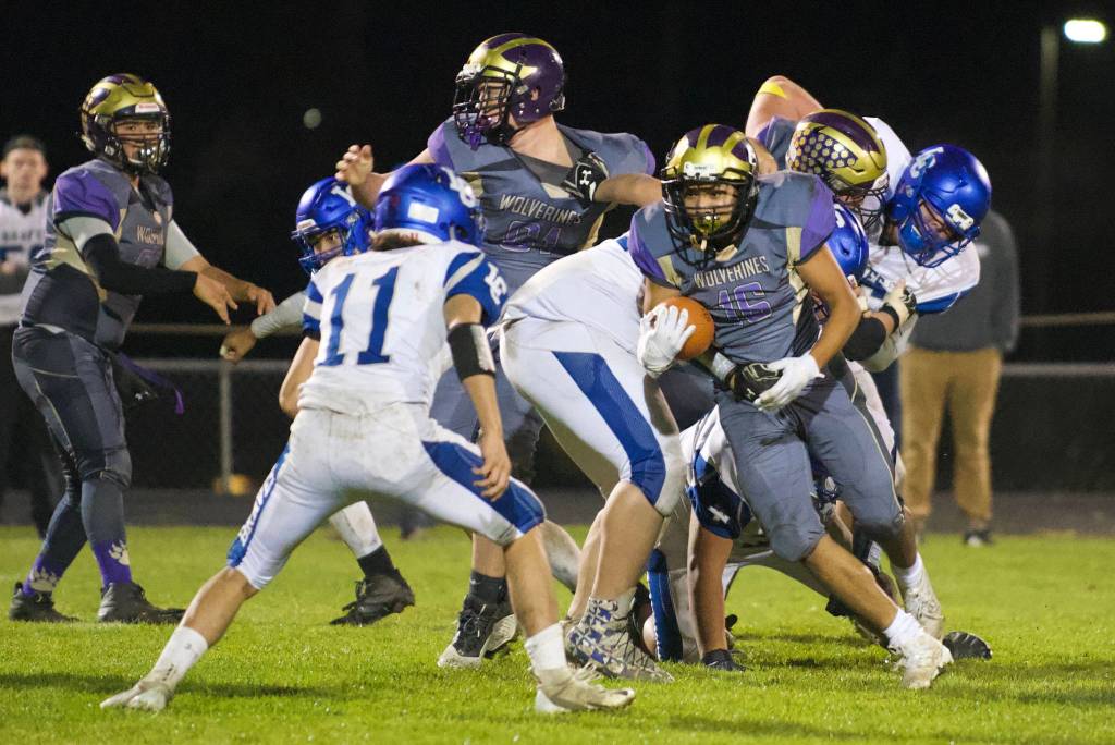 Gabriel Garcia, No. 16, fights his way for a good yardage gain to the goal line. (John Stimpson/Contributed photo.)