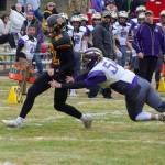 #54 Gavin Mason pushes the Raider ball carrier out of bounds. (John Stimpson/Contributed photo.)