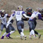 #7 Dylan Roberson throws to his man downfield under Raider pressure. (John Stimpson/Contributed photo.)