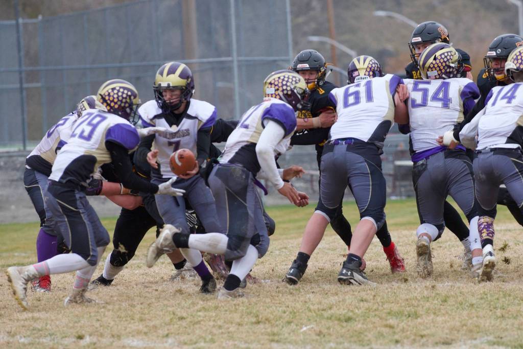 #29 Connor Haines gets the handoff from Quarterback #7 Dylan Roberson for his run up the middle. (John Stimpson/Contributed photo.)