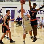 Teagen August, No. 44, under pressure, fires up a layup. (John Stimpson/contributed photo)