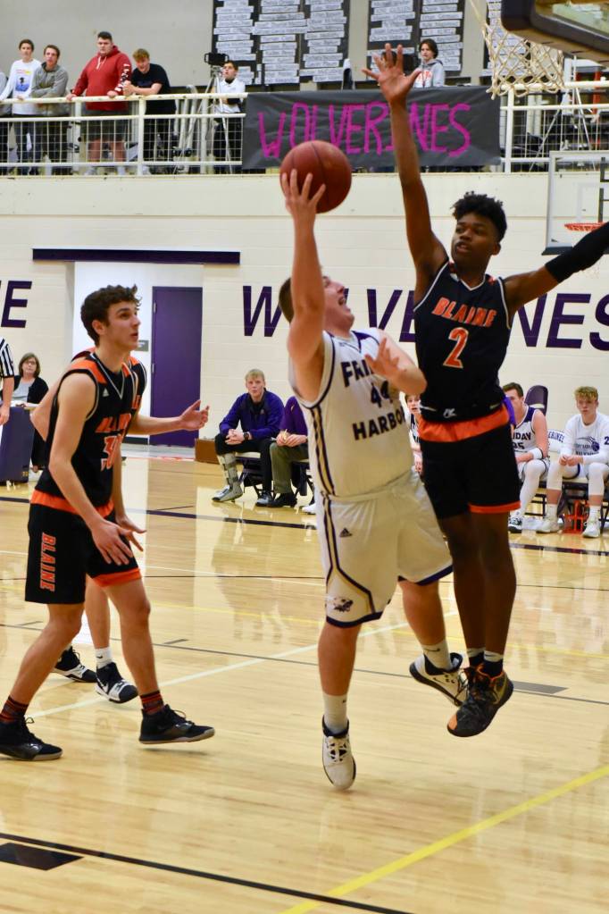 Teagen August, No. 44, under pressure, fires up a layup. (John Stimpson/contributed photo)