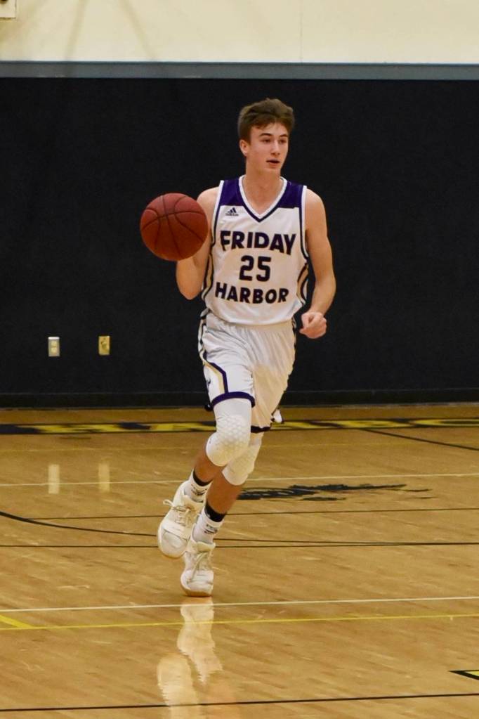 Kenny Hallock brings the ball up the court. (John Stimpson/contributed photo)