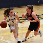 Fallon Taylor, No. 4, drives toward the basket. (John Stimpson/contributed photo)