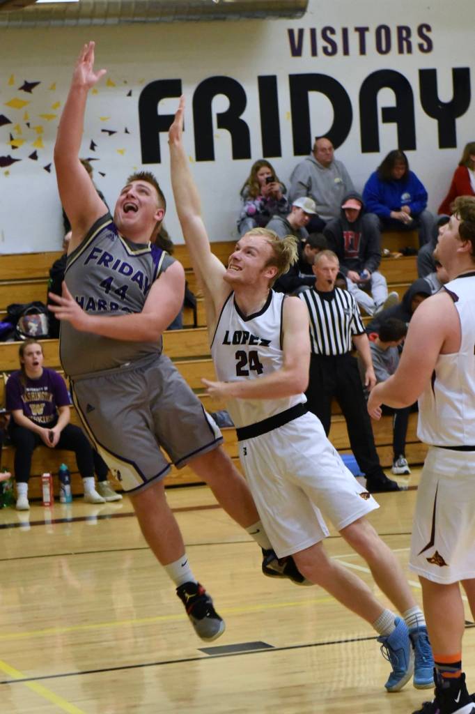 Big Mac August lays up a two-point shot of many against the Lobos. (John Stimpson/contributed photo)