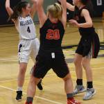 Under heavy Wolves pressure, Fallon Taylor looks to pass to an open player. (John Stimpson/contributed photo)