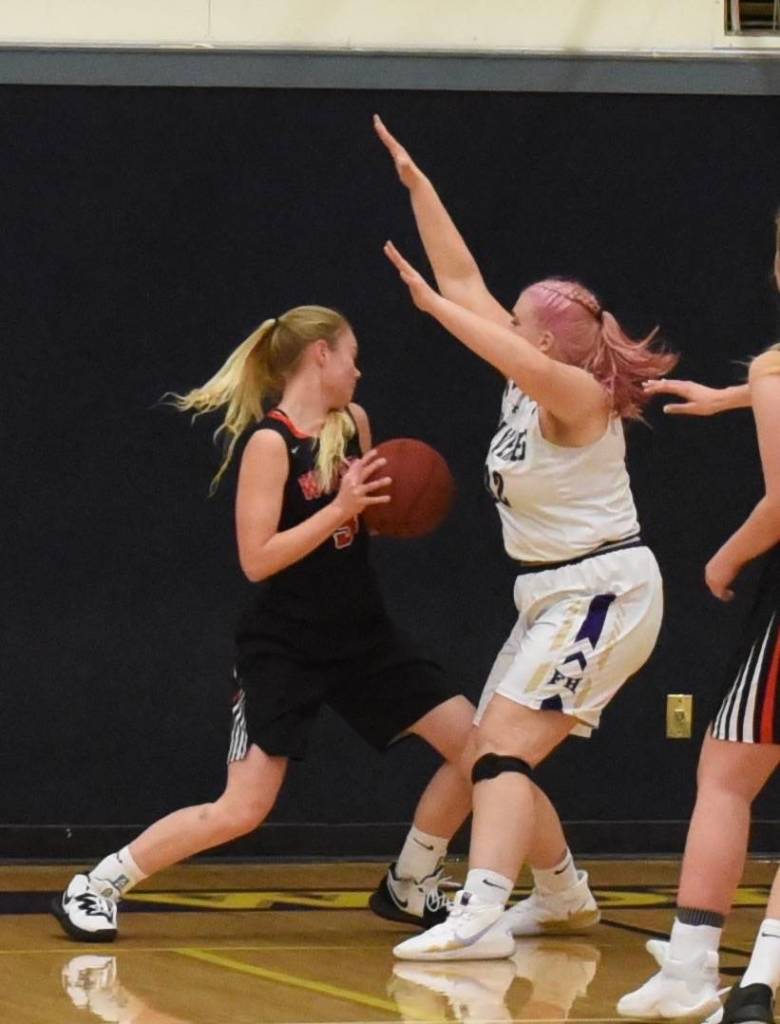 Stella Parsons blocks off and applies pressure to the Wolves at the baseline. (John Stimpson/contributed photo)