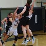 Heavy defensive pressure from JJ Jones and Kenny Hallock thwart a Wolves from scoring. (John Stimpson/contributed photo)