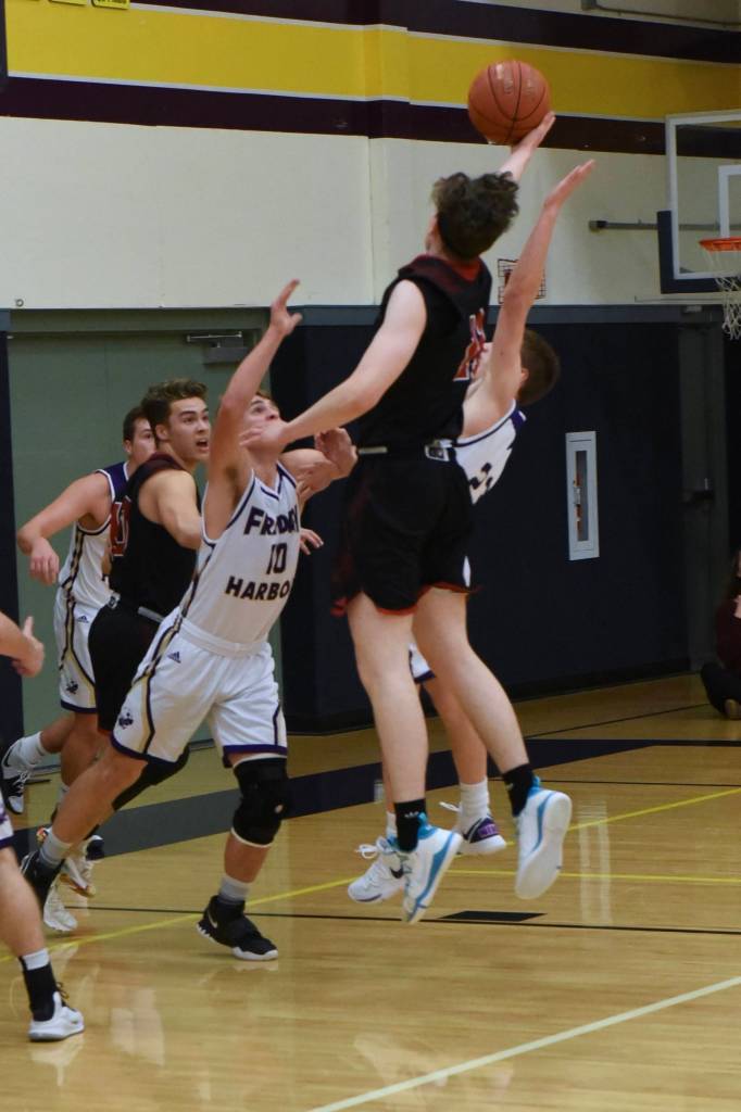 Heavy defensive pressure from JJ Jones and Kenny Hallock thwart a Wolves from scoring. (John Stimpson/contributed photo)