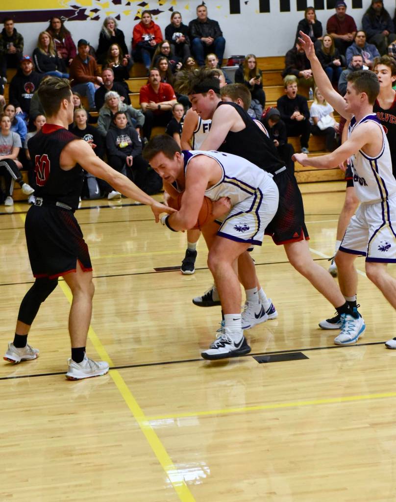 Gavin Mason secures a rebound from the Wolves. (John Stimpson/contributed photo)