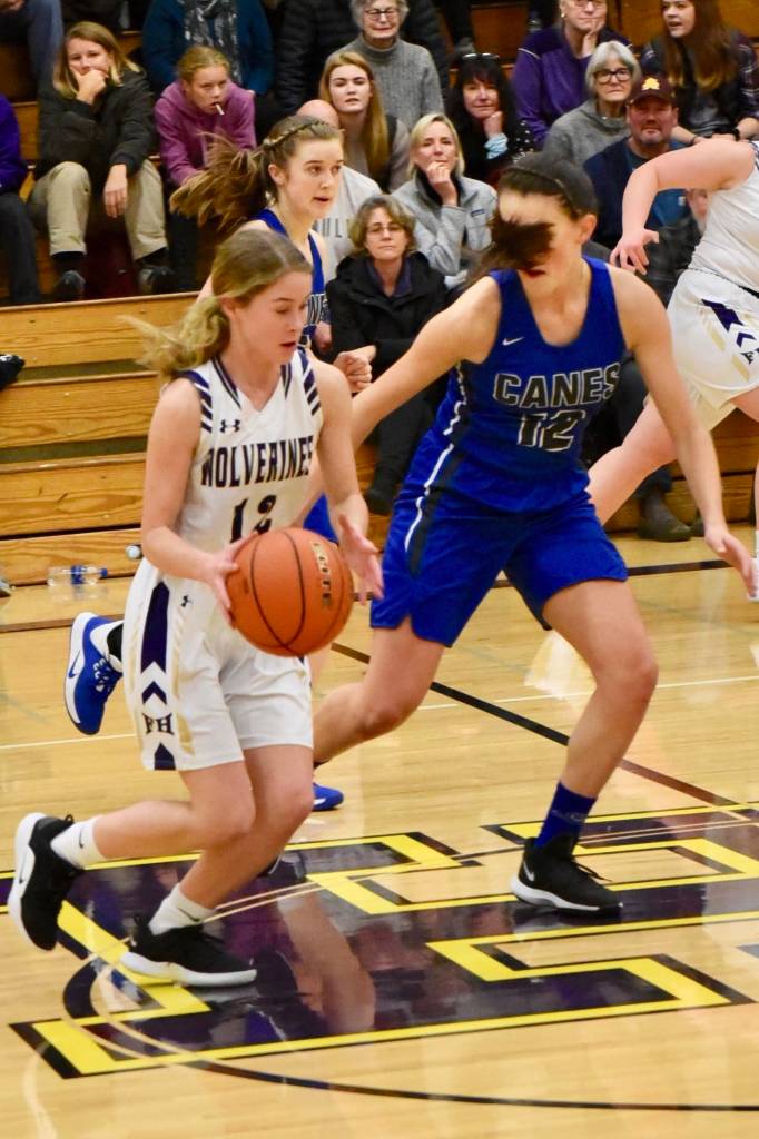 Olivia Germain drives the ball into the center court. (John Stimpson contributed photo.)