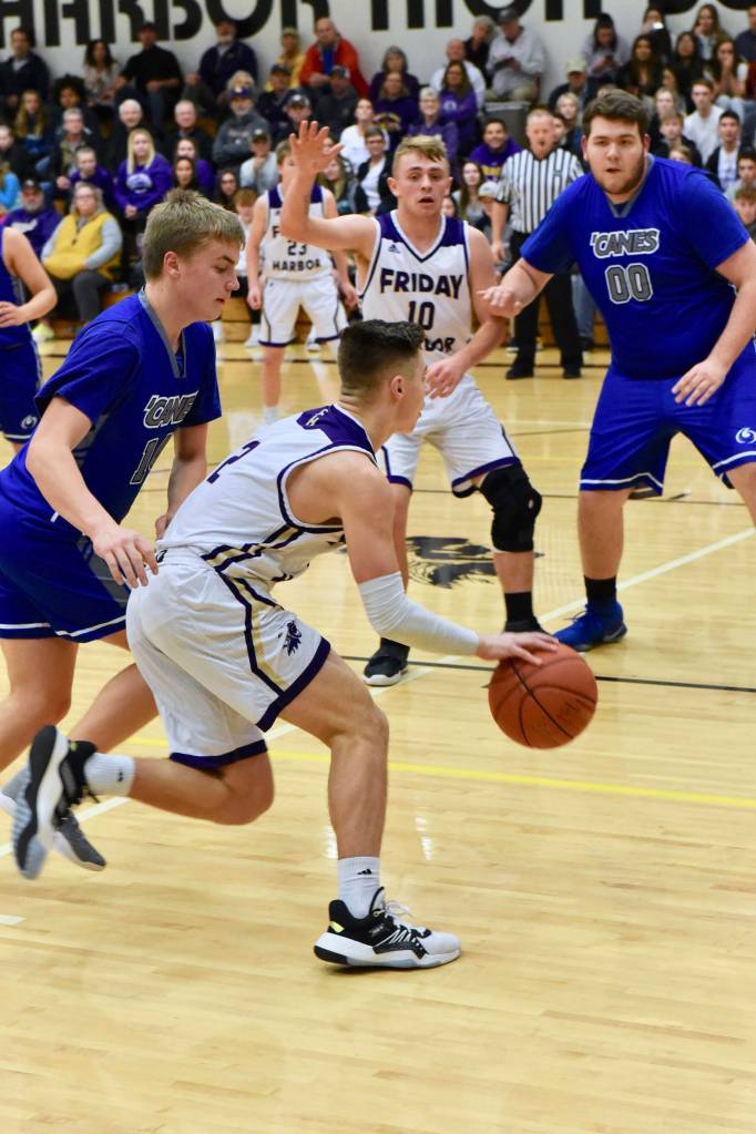 Kyson Jackson drives in toward the basket. (John Stimpson contributed photo.)