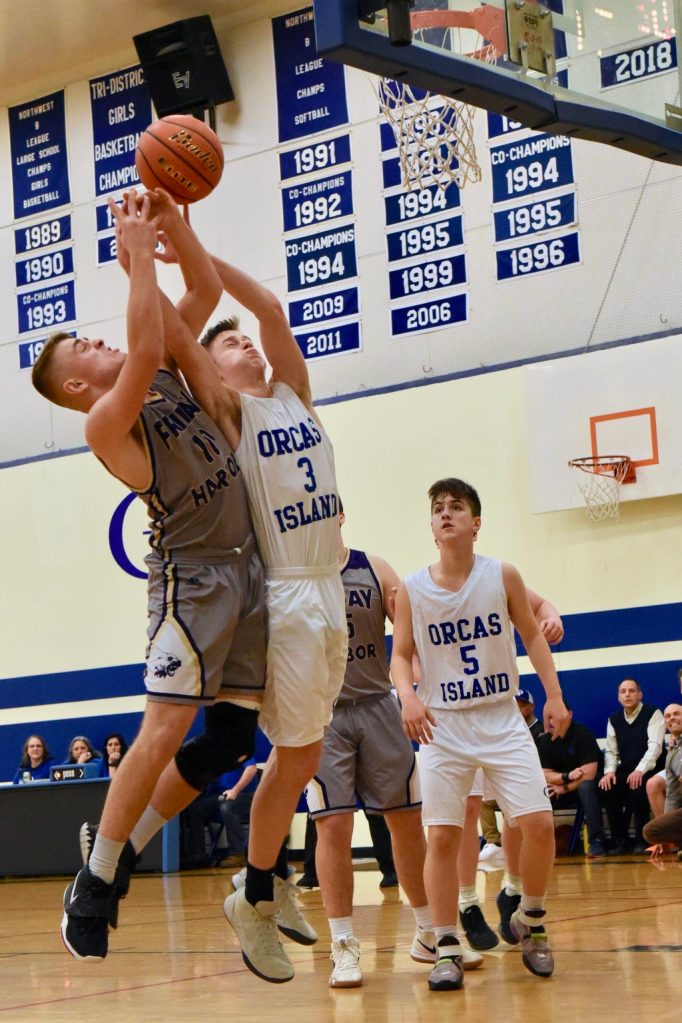 Jaden JJ Jones wrestles for a rebound. (John Stimpson/Contributed photo)