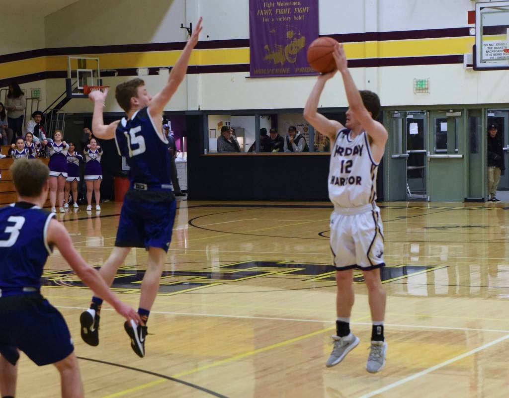 Ethan Germain lets a three-point shot fly. (Contributed photo by John Stimpson.)