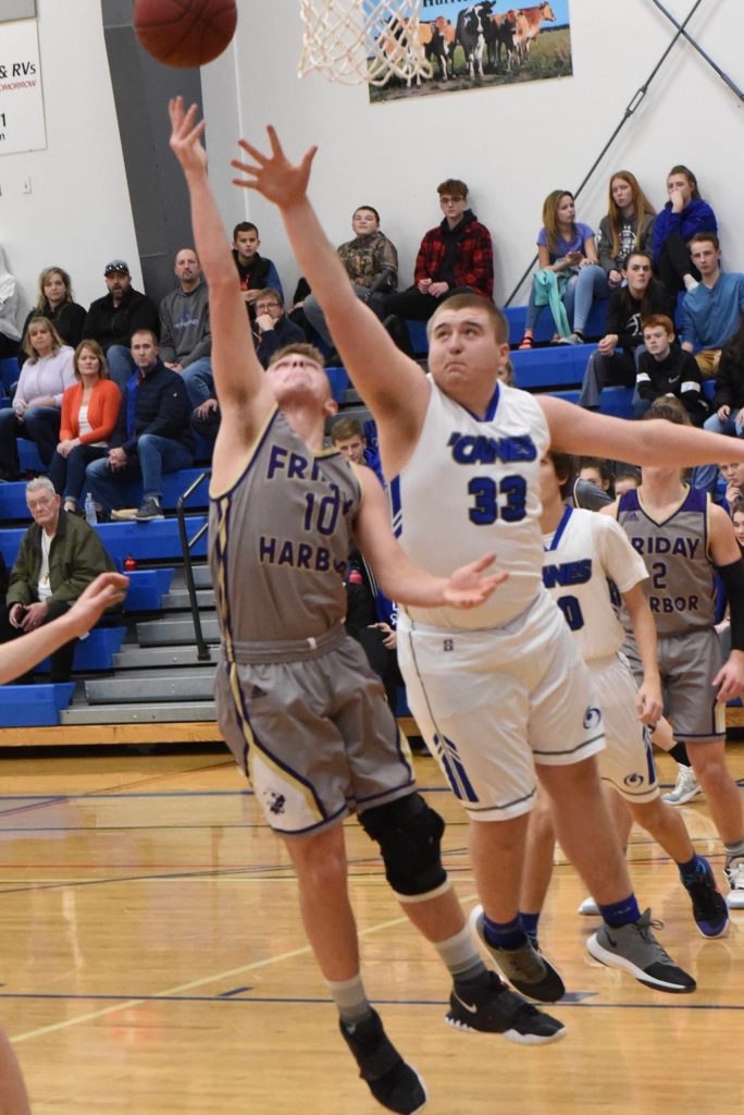JJ Jones reaches high for a rebound. (John Stimpson/contributed photo.)
