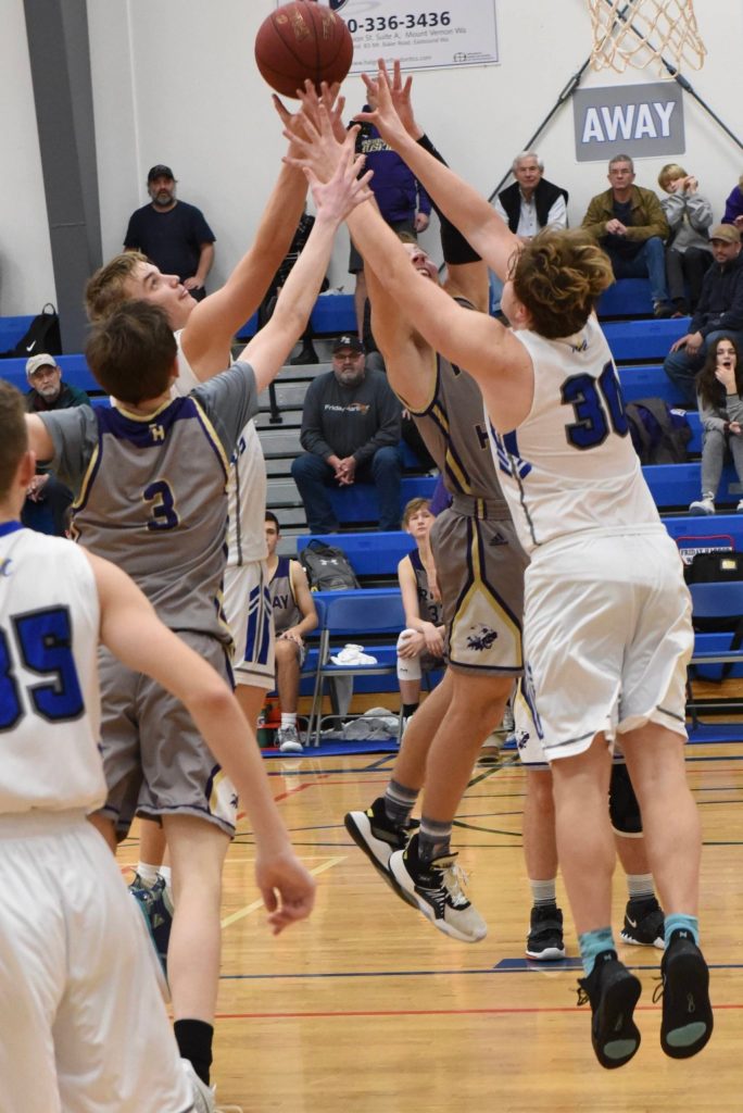 Wolverines and Hurricanes battle for a rebound. (John Stimpson/contributed photo.)