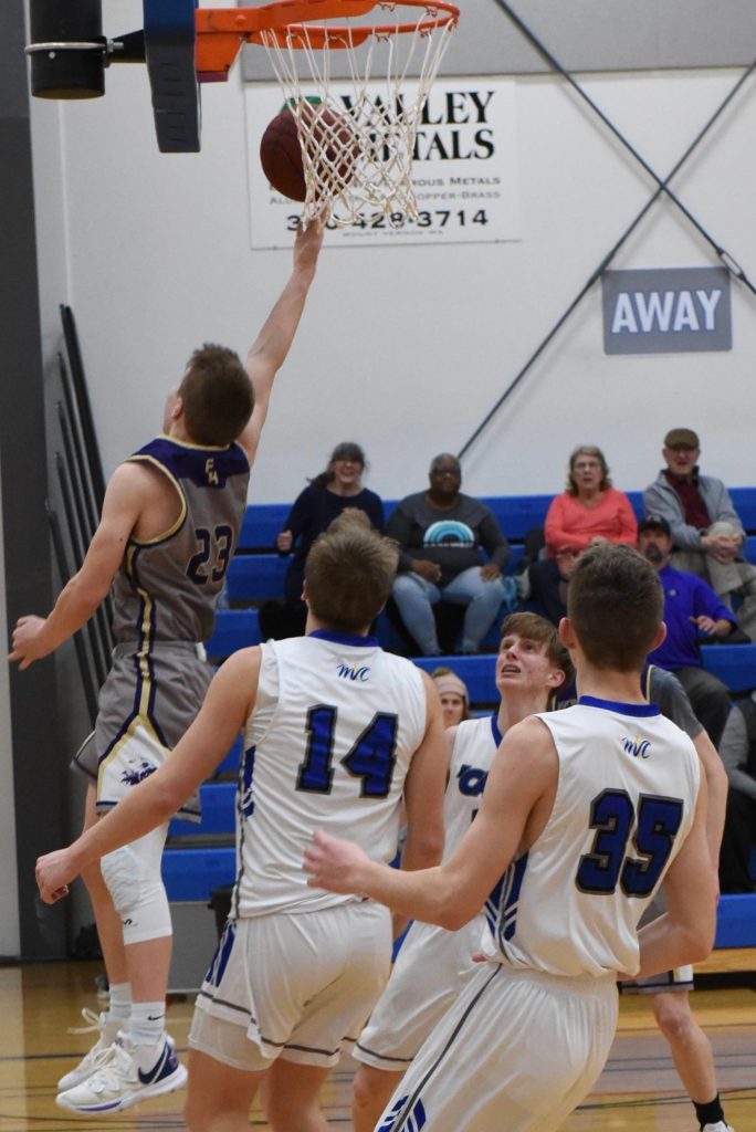 Dylan Roberson goes up for two points and ties the score at 49-49!! He was fouled on this play and makes a 1 point foul shot making the score 50-49! For the win!!! (John Stimpson/contributed photo.)