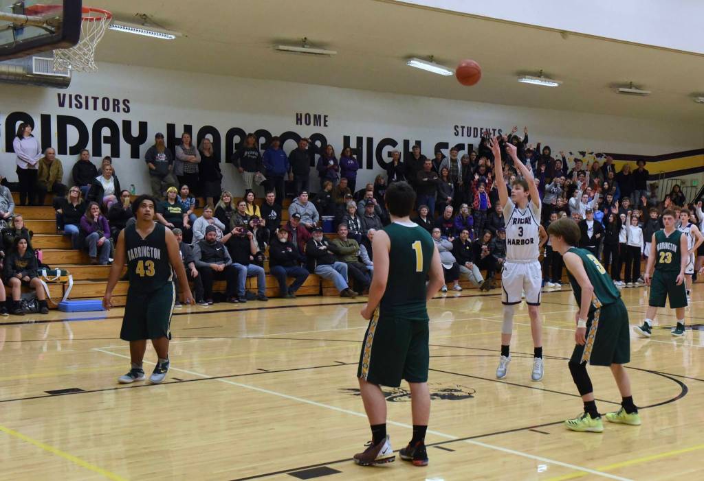Remy August makes the last two baskets from the foul line giving the Wolverines a 44-41 win! (John Stimpson/contributed photo.)