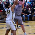 Gavin Mason under pressure shoots for two points! (John Stimpson/contributed photo.)