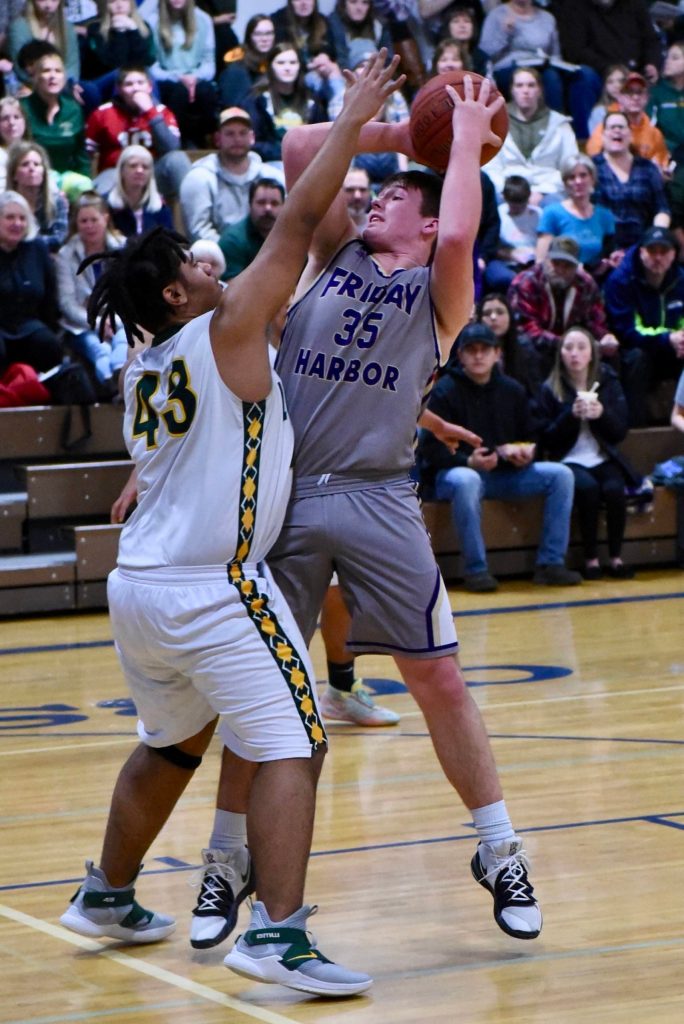Gavin Mason under pressure shoots for two points! (John Stimpson/contributed photo.)