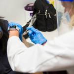 QFC pharmacist Becky Buerhaus administers a flu shot on Wednesday in Everett. (Olivia Vanni / The Herald)