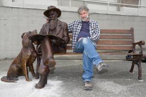 Sculptor Gareth Curtiss, right, with his statue of Friday Harbor founder Edward Warbass and Bob the dog. (Matt Pranger/contributed photo)