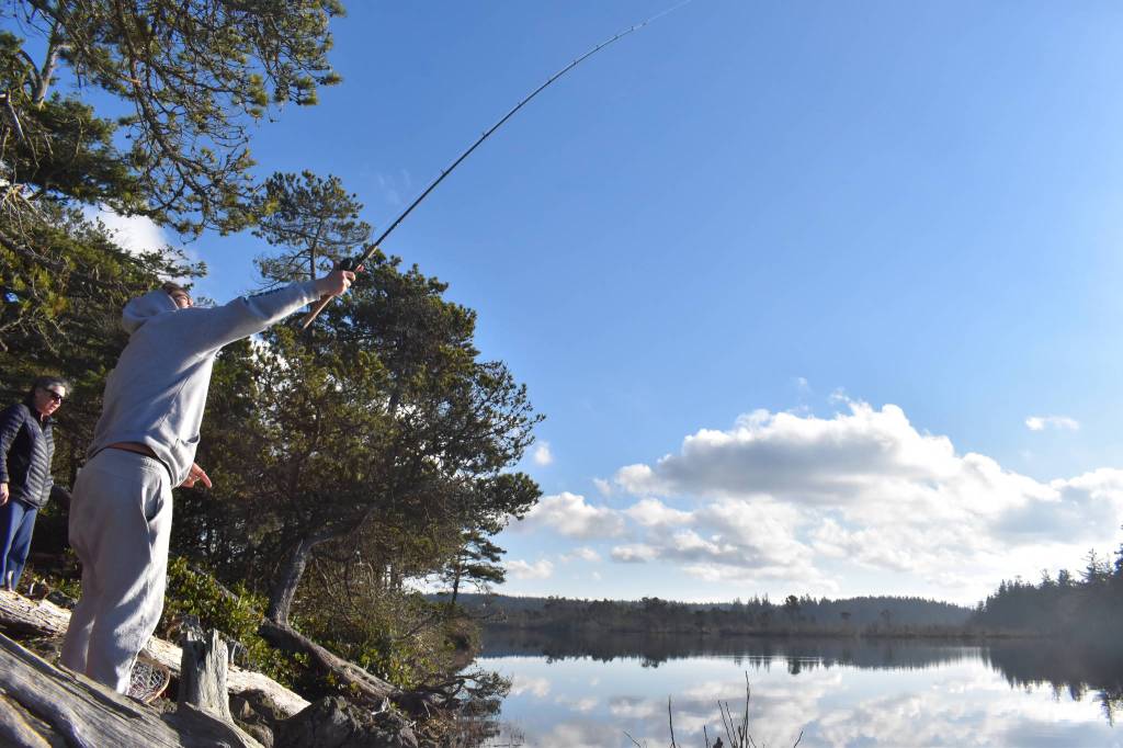 Aiden Santos of Anacortes fishes at Cranberry Lake at Deception Pass State Park last Saturday. The Navy included the park as one of its proposed training sites. (Emily Gilbert/Whidbey News-Times)