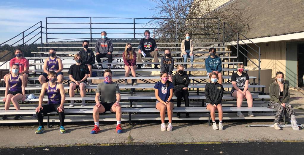 Friday Harbor High School 2021 track and field team. Alex Holman, Kyson Jackson, Ryker Mattox, Sage Penwell, Tristan Collen, Lily Rock, Sofia Duke, Elian Bayas, Aaron Orozco, Mckenna Clark, Blake Riley, Ari Tucker Belt, Nora Flynn. Emma Hermann Manager, Matthew Wolf Manager, Ella Flynn Coach Asst, Shannon S. Plummer Head Coach.